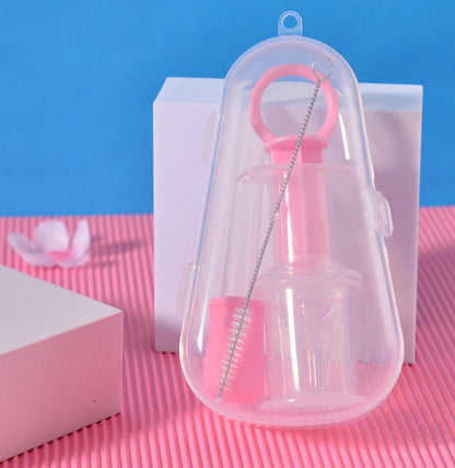 Clear plastic bottle with pink cap and cleaning brush on a pink and blue background