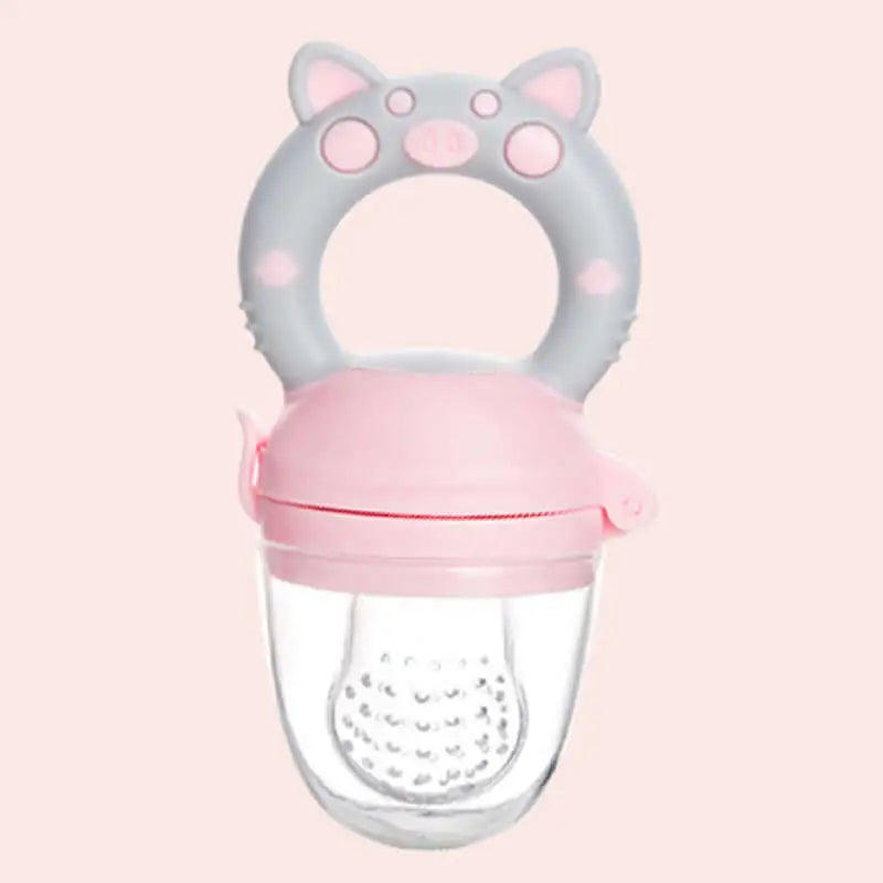 Pink and gray pacifier with cat ears on a light pink background