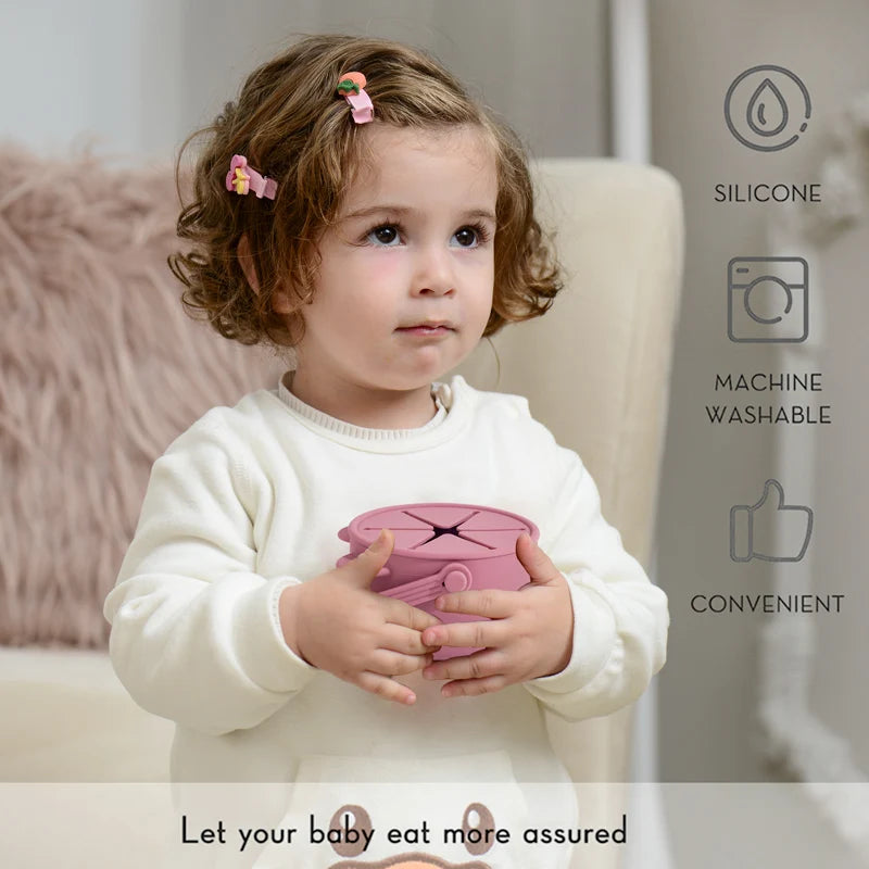 Child holding a pink silicone container with product features displayed on the right.