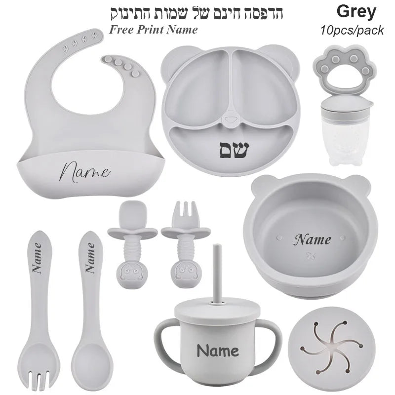 Gray baby utensil set with customizable name on a white background