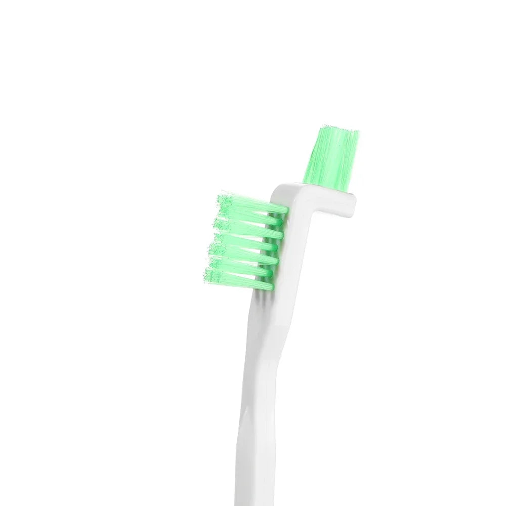 Green and white cleaning brush on a white background