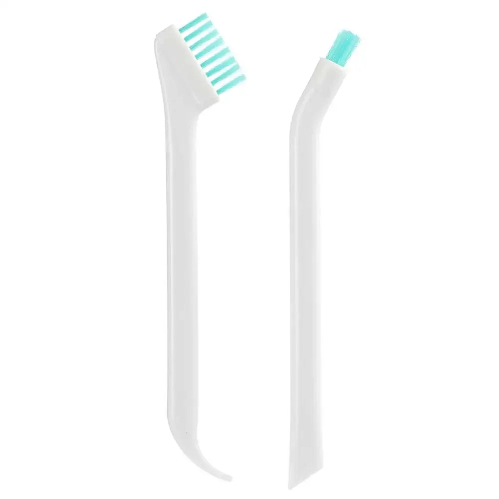 White and green dental cleaning tool on a white background