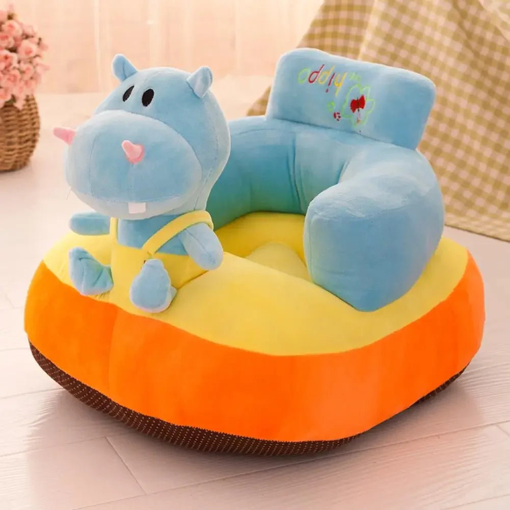 Children's plush hippo seat with colorful design on a light wooden floor.