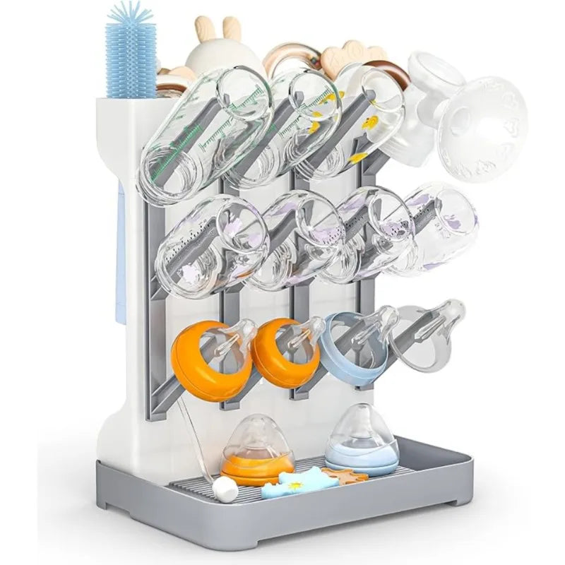 Baby bottle drying rack with various baby bottles and accessories on a white background