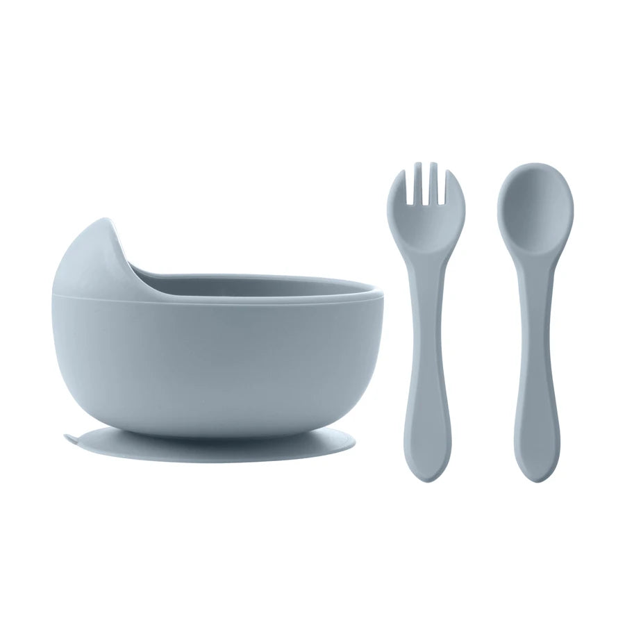 Gray children's bowl, spoon, and fork set on a white background