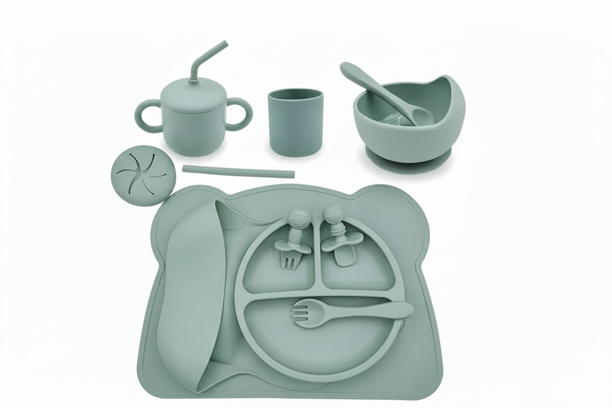 Children's silicone dining set with various utensils and a tray on a white background.