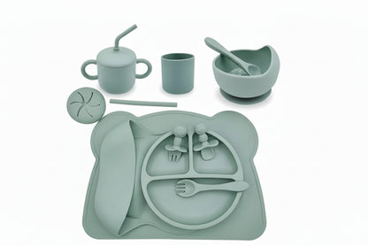 Children's silicone dining set with various utensils and a tray on a white background.