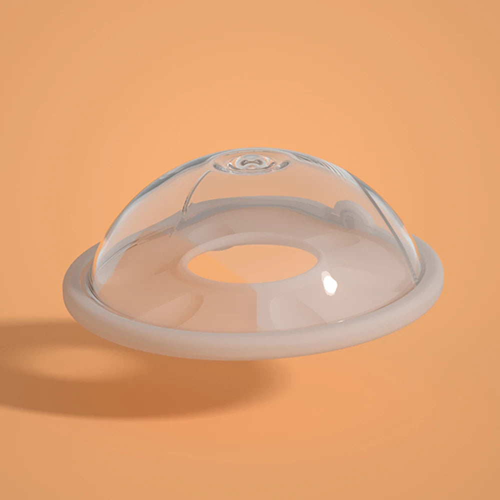 Clear dome lid on a round base against an orange background