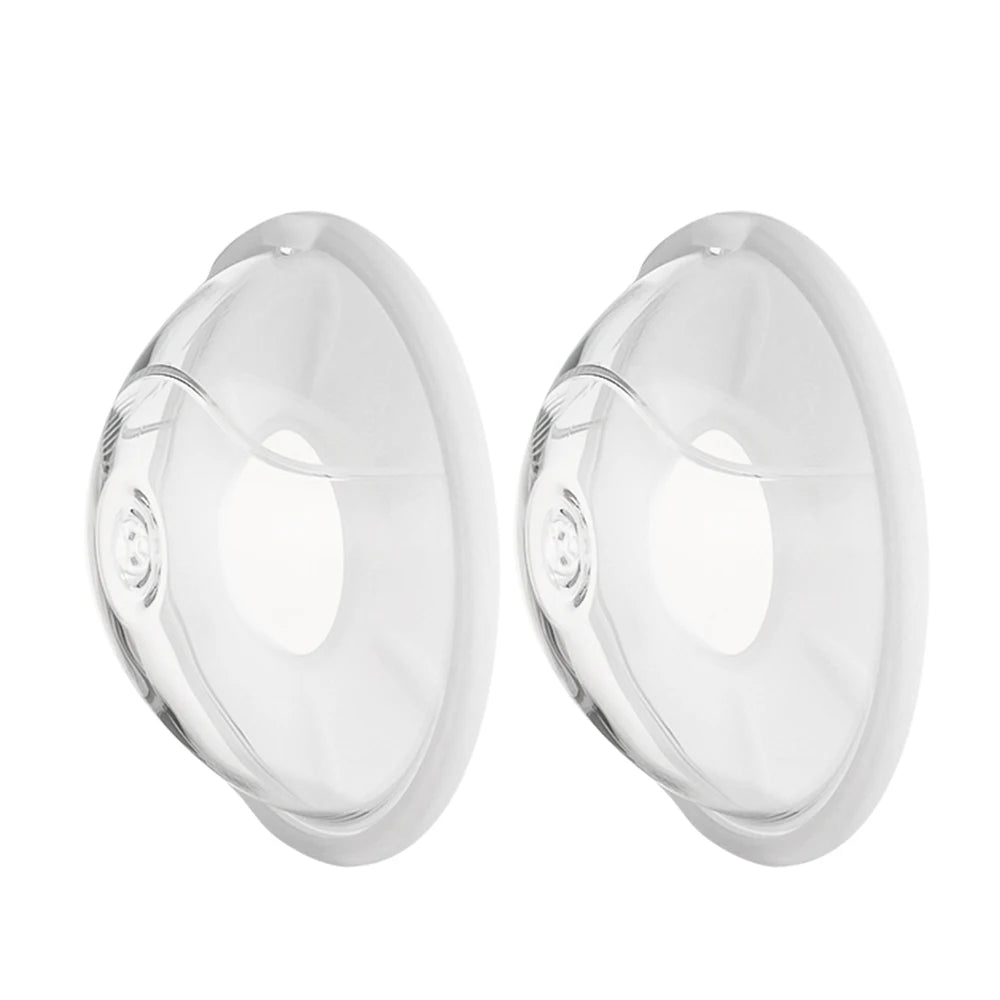 Two clear silicone breast forms on a white background