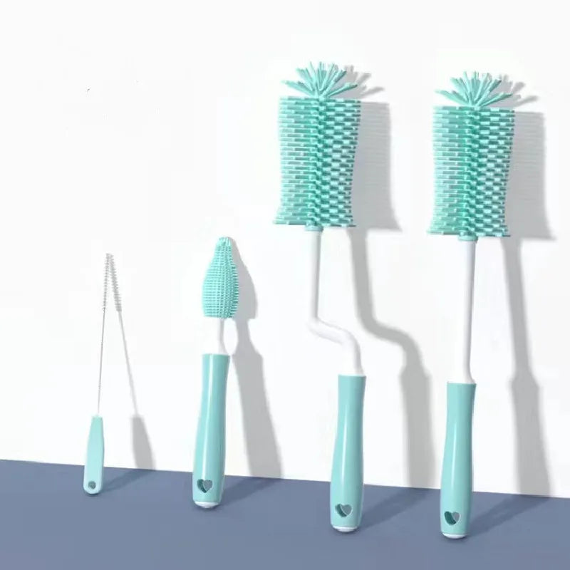 Set of four turquoise cleaning brushes with different bristle designs on a white background.
