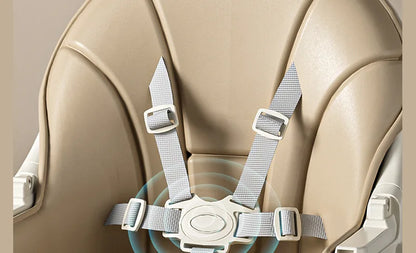 Close-up of a beige car seat with gray straps on a neutral background