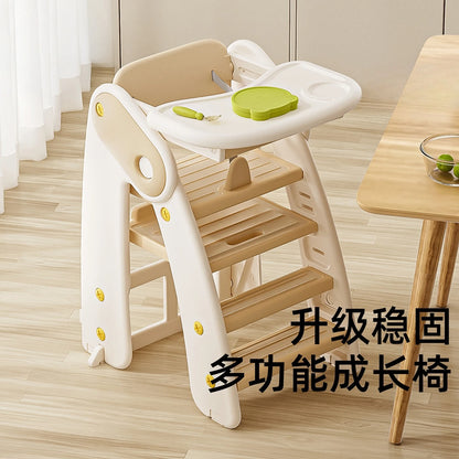 Children's multi-functional growth chair with a white tray and wooden steps on a wooden floor.