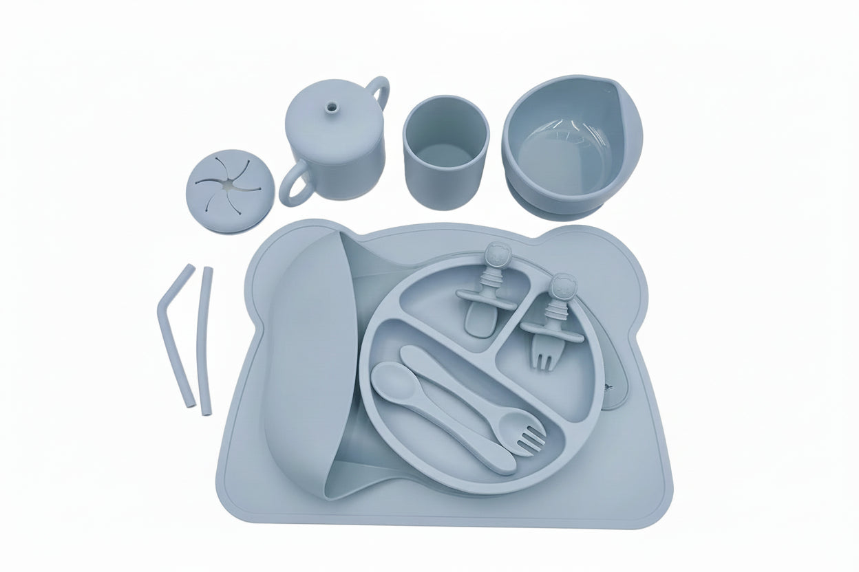 Gray children's dining set with tray, cups, bowl, and utensils on a white background.