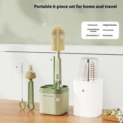 Portable 6-piece cleaning set with bottle brush, nipple brushes, and storage box on a wooden surface.