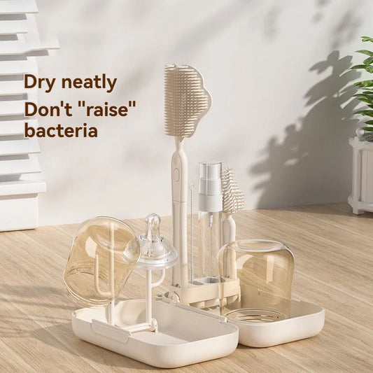 Beige and white baby bottle cleaning set on a wooden surface with text overlay.