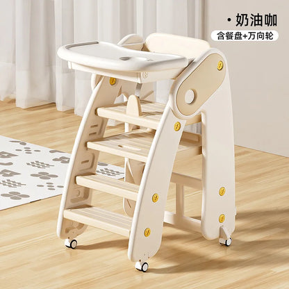 Wooden children's chair with tray on a wooden floor