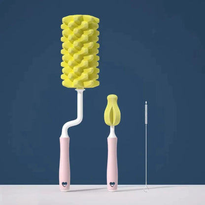 Yellow and pink cleaning brush with detachable head on a dark blue background