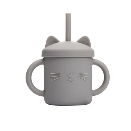 Gray cat-shaped sippy cup with a lid and straw on a white background