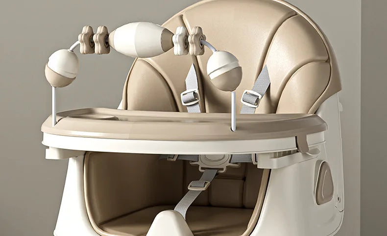 Beige high chair with toy attachments on a neutral background