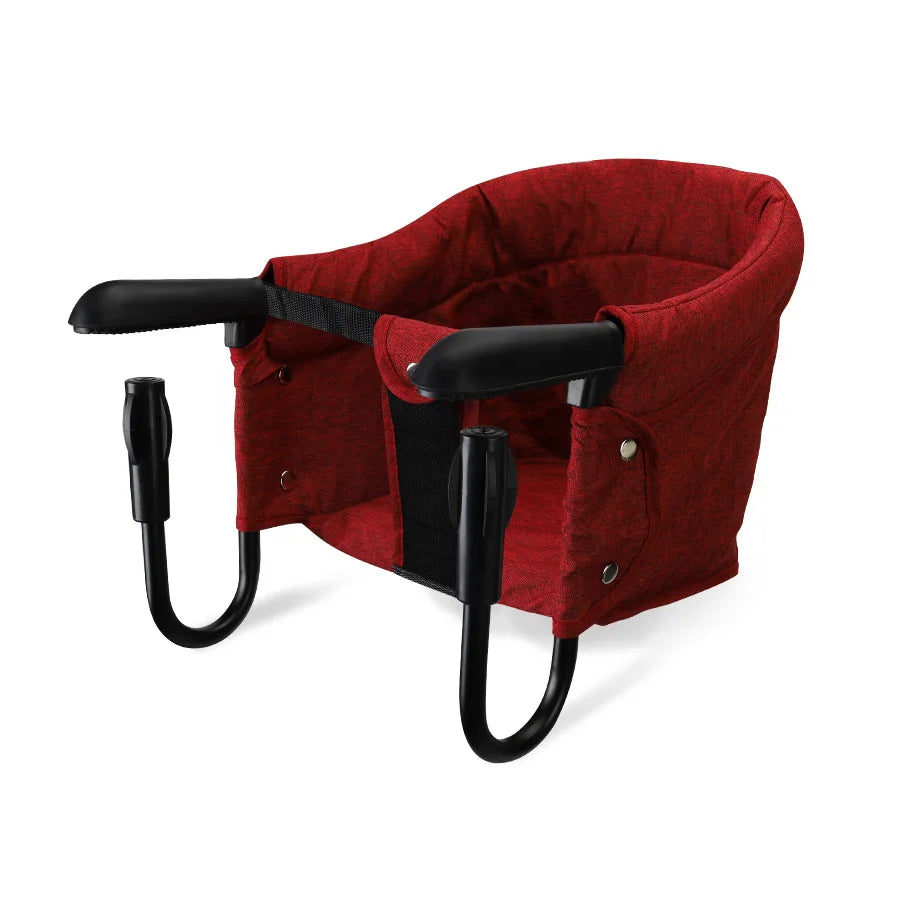 Red baby seat with black frame on a white background