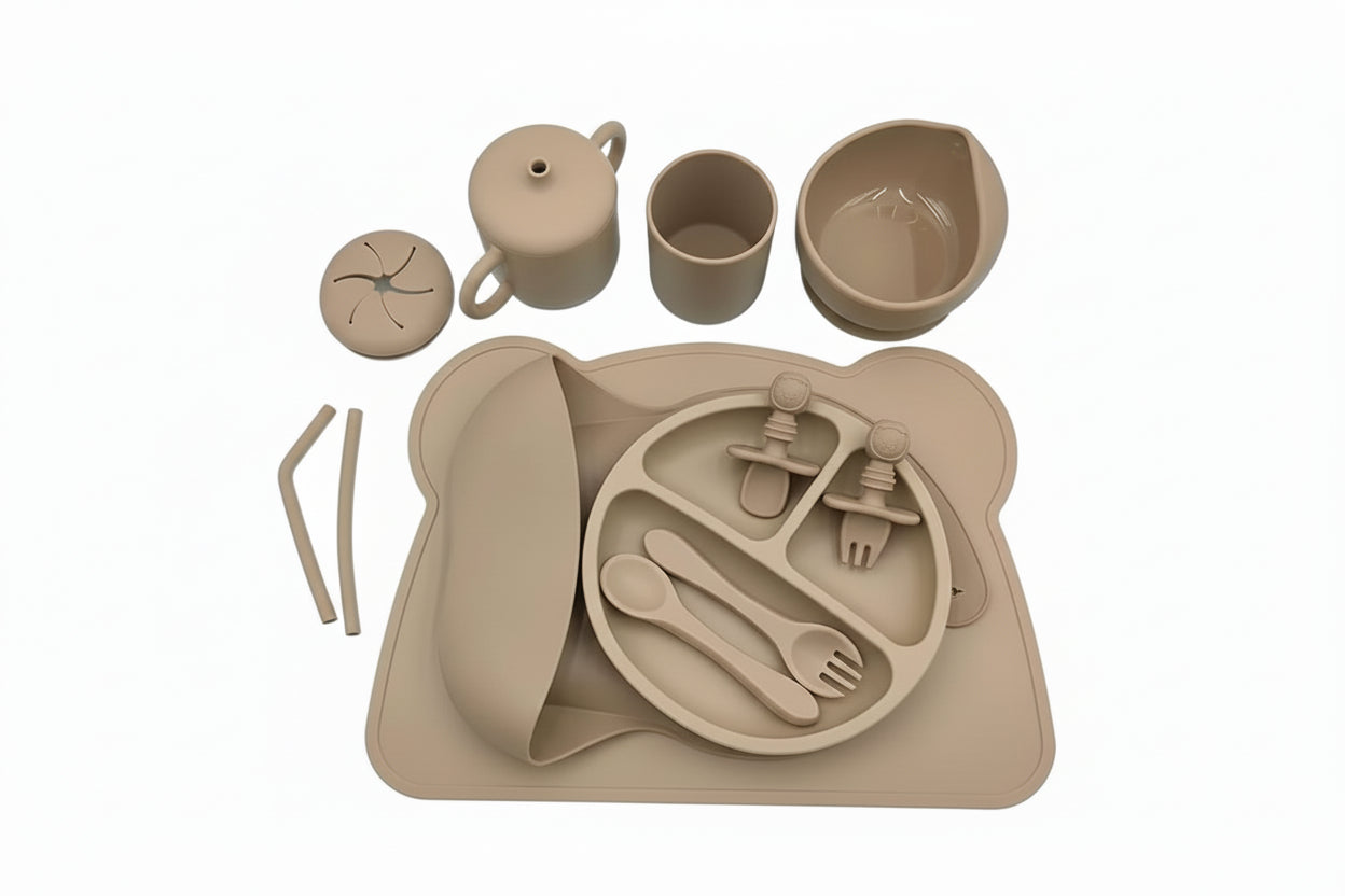 Brown children's dinner set with plate, cups, and cutlery on a white background