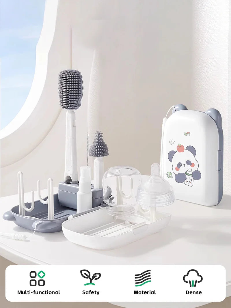 Baby bottle cleaning set with panda design on a white surface