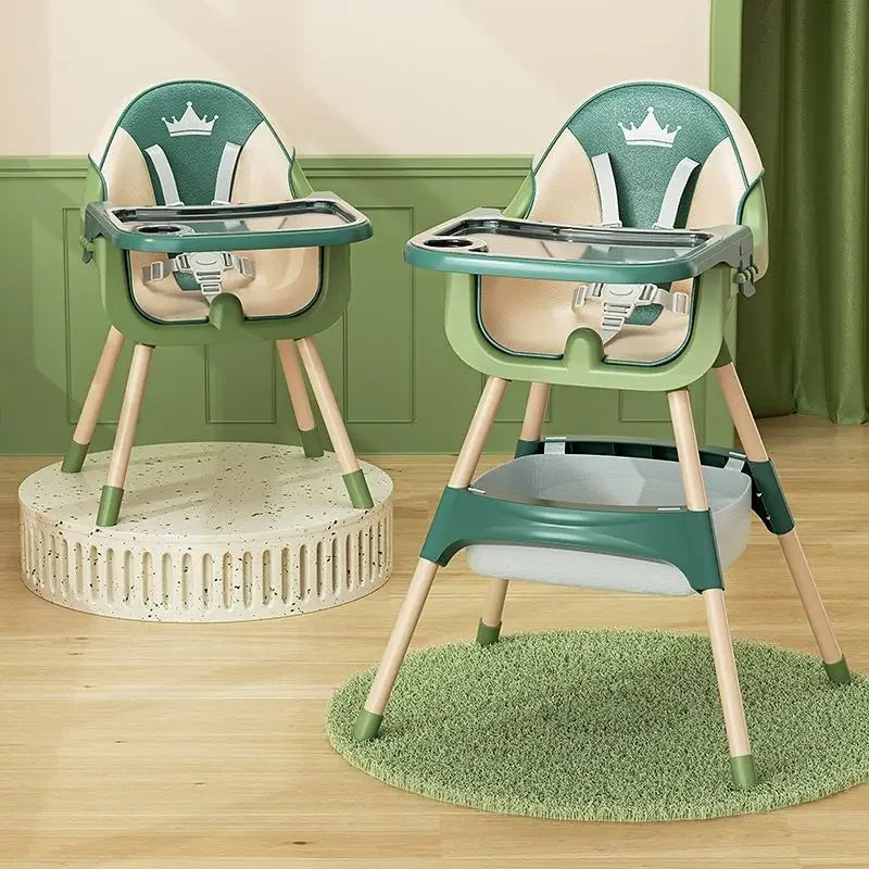 Two green and beige high chairs on a wooden floor with a green wall in the background.