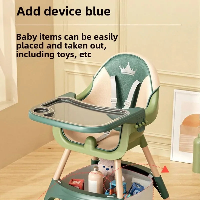 Green baby high chair with tray on a wooden floor